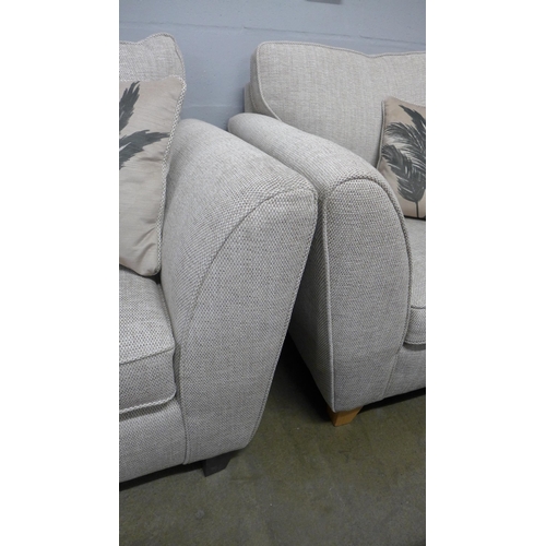 1346 - An oatmeal upholstered three seater sofa and armchair - RRP £1898