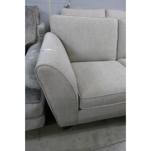 1347 - A beige textured weave two seater sofa - RRP £1099