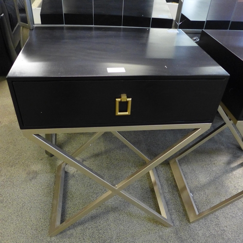 1545 - A pair of black bedside chests with cross legs