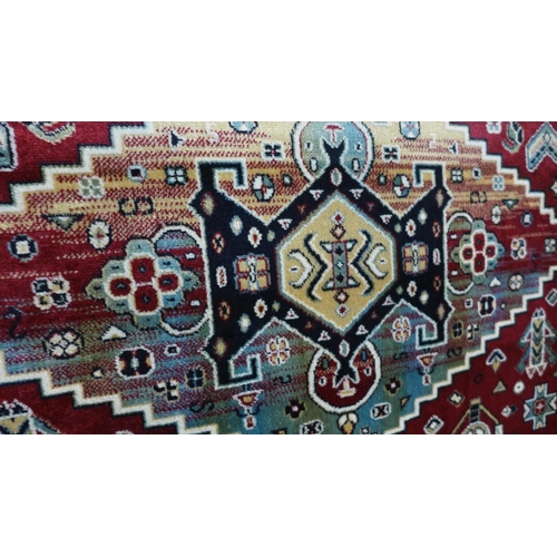 1573 - A red ground Royal Palace rug with Aztec design, 170xm x 120cm