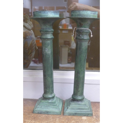 792 - A pair of verdigris brass candlesticks, 35cm