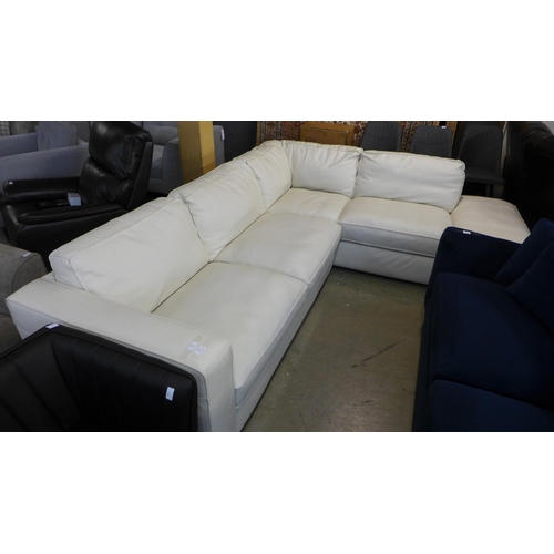 1431 - A Natuzzi two piece sectional cream leather sofa, original RRP £1916.66 + VAT, damaged leather on ba... 