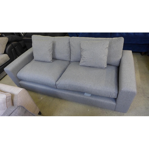 1434 - A mid grey upholstered three seater sofa