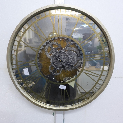 1327 - A mirrored round clock showing moving mechanism (18570)   *