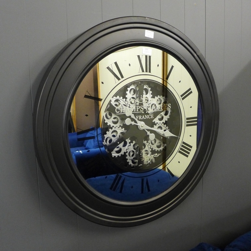 1370 - A black large moving gears mirrored clock