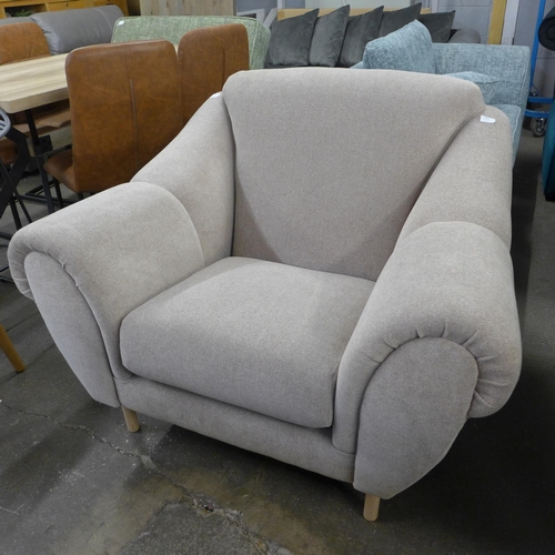 1412 - A stone-coloured upholstered armchair