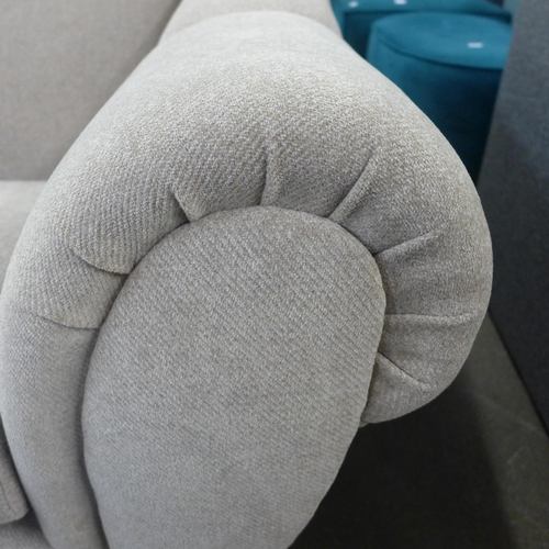 1412 - A stone-coloured upholstered armchair