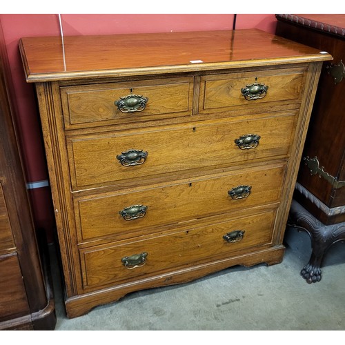 164 - A late Victorian walnut chest of drawers