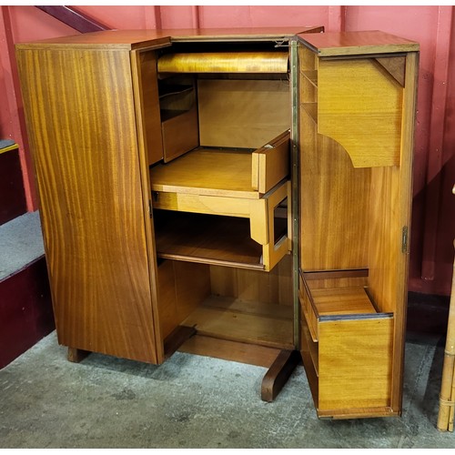 69 - A teak home office cabinet