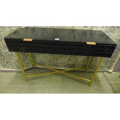 1559 - A black console table with gold legs