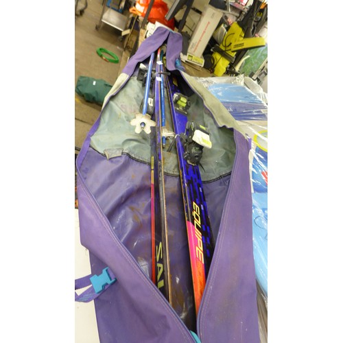 2078 - Pair of Saloman Equipe 9000 skis and poles in case