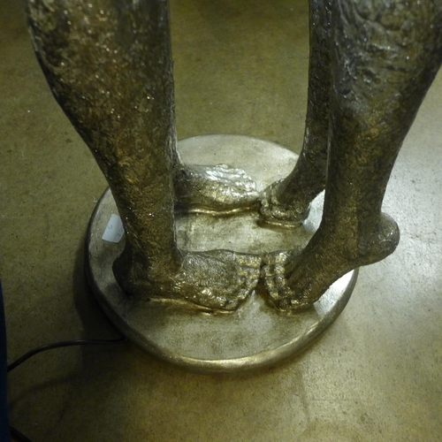 1309 - A silver floor standing Embracing Lovers lamp