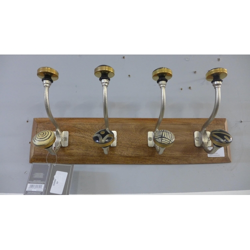 1314 - A rack of four coat hooks with ceramic knobs (HH563916)   #