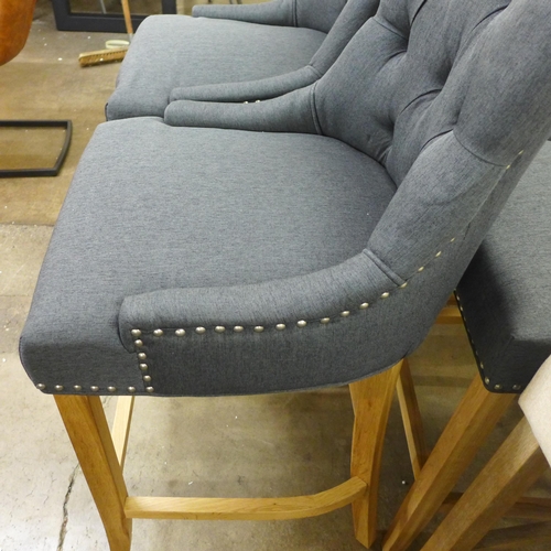 1494 - A pair of Bradley dark grey upholstered button back bar stools