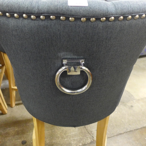 1494 - A pair of Bradley dark grey upholstered button back bar stools