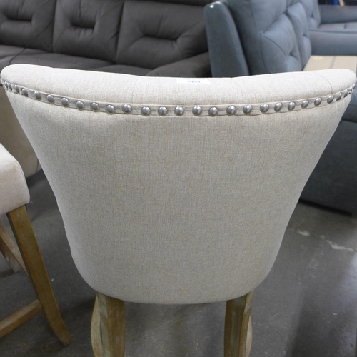 1496 - A pair of Bradley cream upholstered button back bar stools