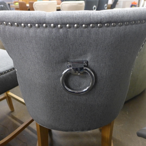 1501 - A pair of Bradley light grey upholstered button back bar stools