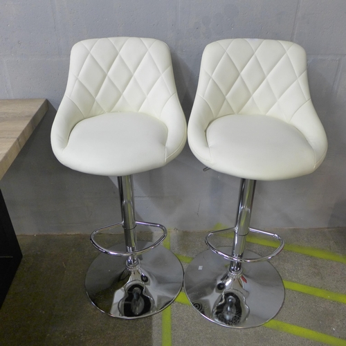 1502 - A pair of Aldin cream upholstered diamond stitching gas lift bar stools