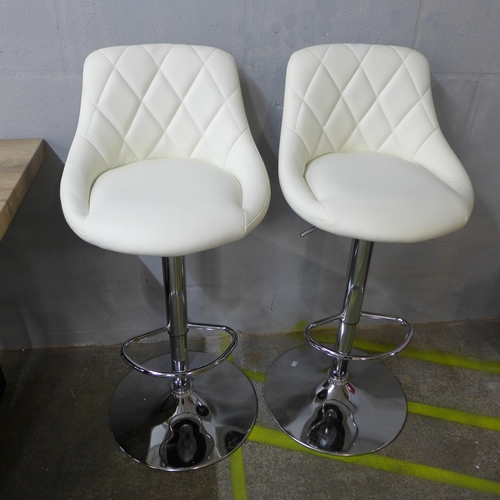 1510 - A pair of Aldin cream upholstered diamond stitching gas lift bar stools