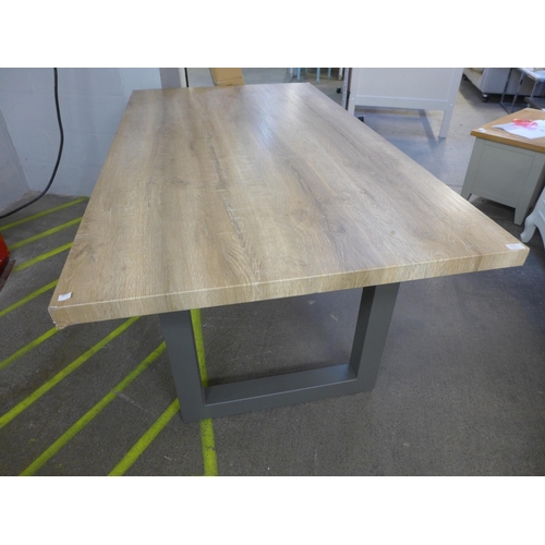 1515 - A Burton 1.8m oak effect dining table, damaged