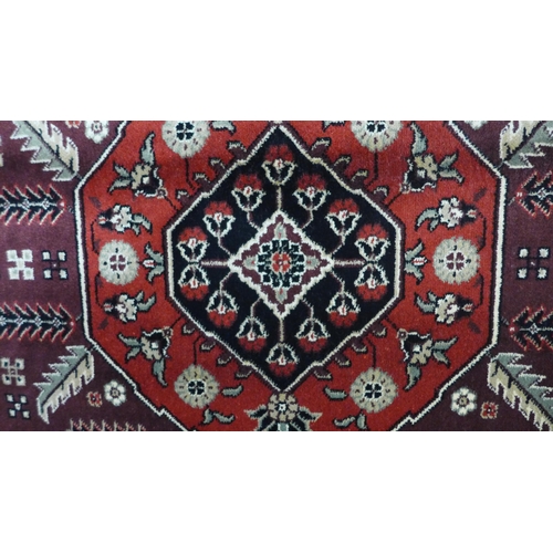 1517 - A red ground full pile Cashmere carpet with Afghan design, 300 x 200cm