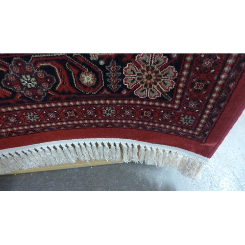 1517 - A red ground full pile Cashmere carpet with Afghan design, 300 x 200cm