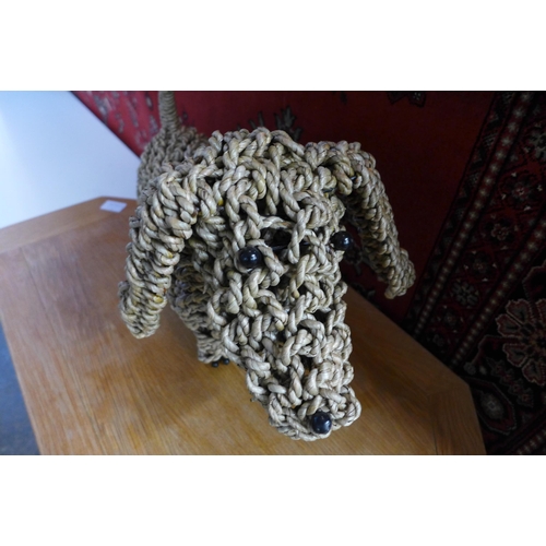 1518 - A standing hand made seagrass sausage dog, H 27cms (ACC09523)   #