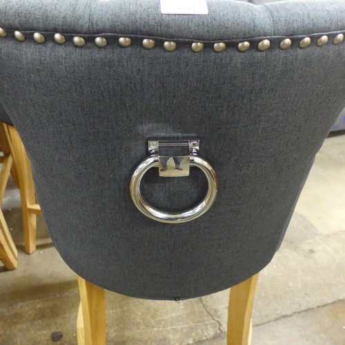 1495 - A pair of Bradley dark grey upholstered button back bar stools