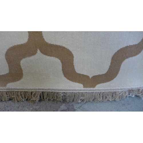 1540 - A cream ground Cashmere carpet, full pile with an all over contemporary design, 300cm x 200cm