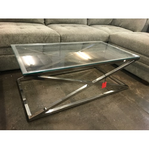 1453 - A chrome and glass top coffee table