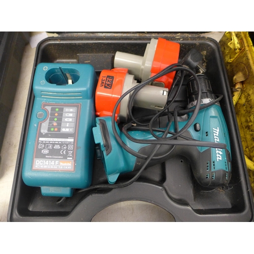 2009 - Makita cordless drill with 2 batteries and charger in case