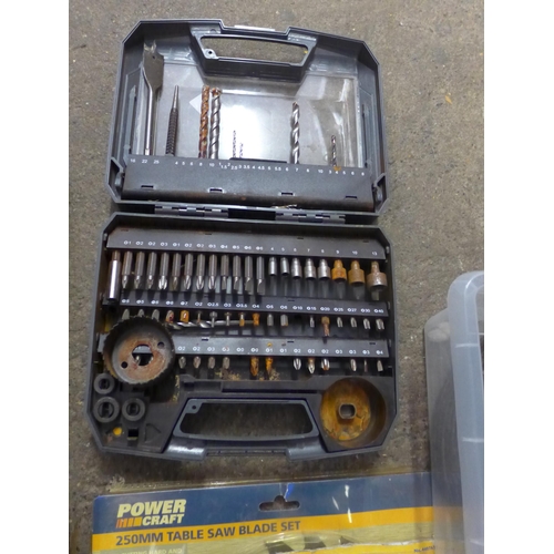 2027 - Box with table saw, blades, helmet, drill bits, rawl plugs and cutting discs