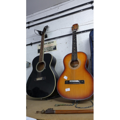 2148 - Two acoustic guitars, a violin and ukelele