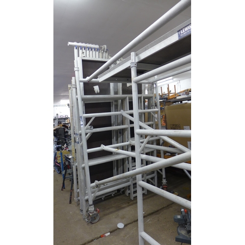 2340 - Lewis approx 20ft aluminium scaffold tower with support poles, 3 work platforms and 6 side sections