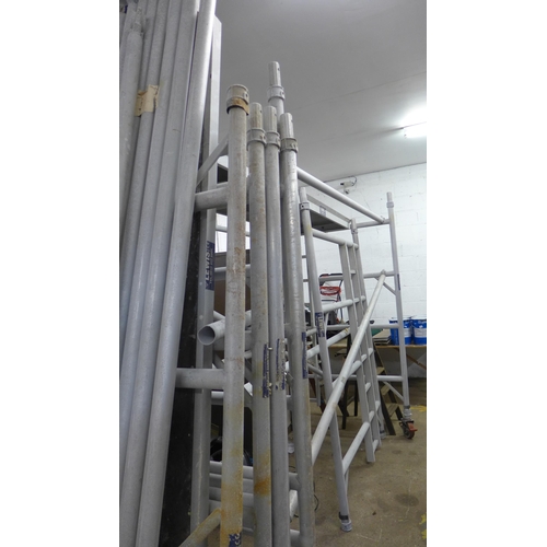 2340 - Lewis approx 20ft aluminium scaffold tower with support poles, 3 work platforms and 6 side sections