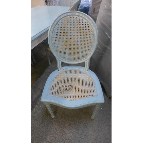 1556 - A blue and white painted dining table and six chairs, damage to two chairs