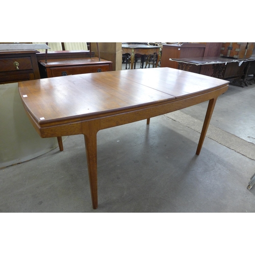 101 - A Danish teak extending dining table