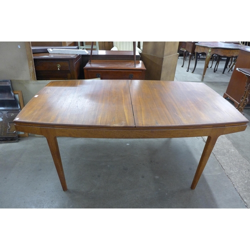 101 - A Danish teak extending dining table