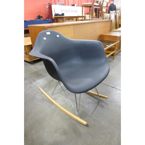 108 - An Eames style black Perspex, chrome and beech rocking chair