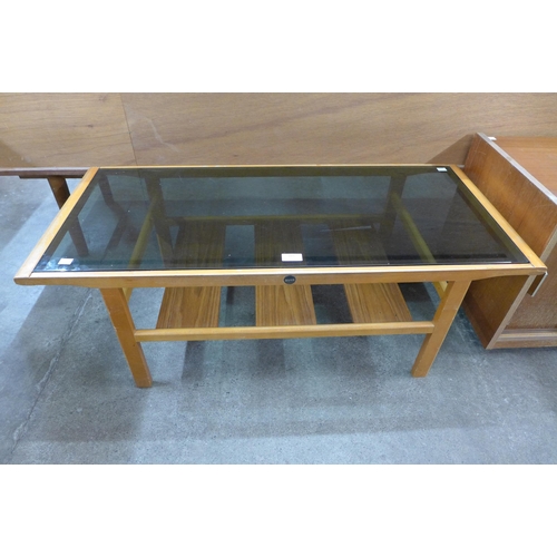 109 - A Myer teak and glass topped coffee table