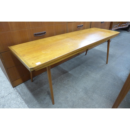 112 - A teak coffee table