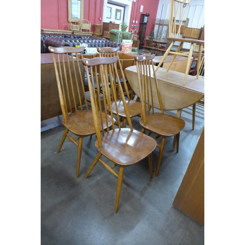 116 - A set of four Ercol elm and beech Goldsmith chairs