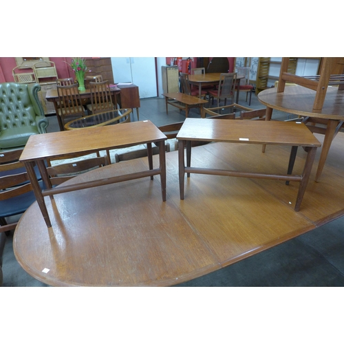 122 - A pair of teak occasional tables