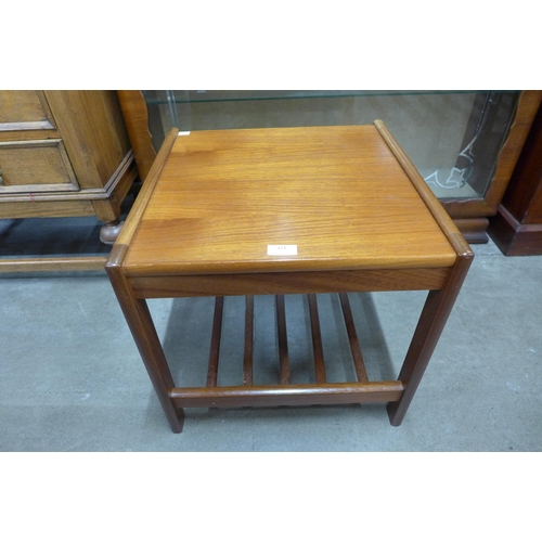 123 - A teak occasional table