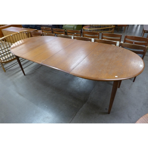 125 - A Danish teak extending dining table