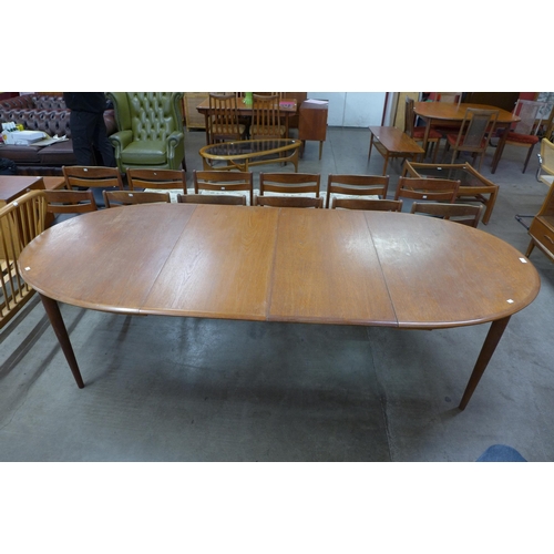 125 - A Danish teak extending dining table