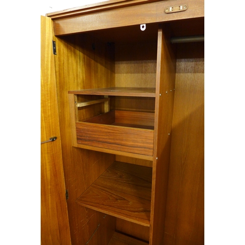 128 - A G-Plan Danish Design teak two door wardrobe, designed  by Ib Kofod Larsen