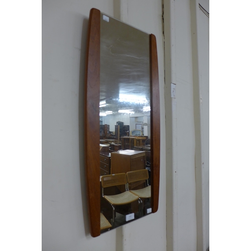 131 - A teak framed mirror