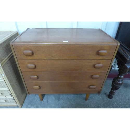 132 - A teak chest of drawers