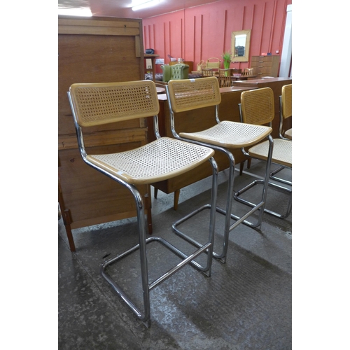 137 - A pair of Italian Marcel Breuer style chrome and beech cantilever stools